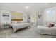 Bright main bedroom featuring patterned wallpaper, carpeted floor and an abundance of natural light at 101 N Bloodworth St, Raleigh, NC 27601