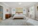 Calm main bedroom featuring patterned wallpaper, carpeted floor and an abundance of natural light at 101 N Bloodworth St, Raleigh, NC 27601