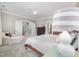 Spacious main bedroom with a seating area, ensuite bath, and a staircase entrance at 101 N Bloodworth St, Raleigh, NC 27601