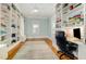 Bright office with custom built-in bookshelves and desk, hardwood floors, and lots of natural light at 101 N Bloodworth St, Raleigh, NC 27601