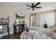Bedroom offering natural light, wood-look flooring and a ceiling fan at 1033 Leatherstone Ln, Fuquay Varina, NC 27526