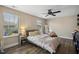 Bedroom offering natural light, wood look flooring and a ceiling fan at 1033 Leatherstone Ln, Fuquay Varina, NC 27526