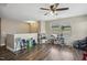 Bonus room features a ceiling fan, natural lighting and wood-look flooring at 1033 Leatherstone Ln, Fuquay Varina, NC 27526