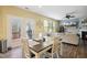 Eat-in kitchen with white cabinets, stainless appliances, and access to back deck at 1033 Leatherstone Ln, Fuquay Varina, NC 27526