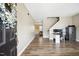 Inviting entryway with hardwood floors, a desk, and a staircase leading to the upper level at 1033 Leatherstone Ln, Fuquay Varina, NC 27526