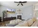 Cozy living room features a fireplace, TV, stylish furniture, and neutral walls at 1033 Leatherstone Ln, Fuquay Varina, NC 27526