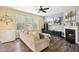 Comfortable living room with fireplace, large television, and neutral colored walls and furniture at 1033 Leatherstone Ln, Fuquay Varina, NC 27526