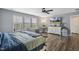 Main bedroom featuring large windows, neutral tones, and hardwood floors at 1033 Leatherstone Ln, Fuquay Varina, NC 27526