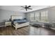 Bright, spacious main bedroom with large windows and hardwood floors at 1033 Leatherstone Ln, Fuquay Varina, NC 27526