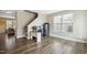 Home office space featuring hardwood floors, a desk, and a staircase leading to the upper level at 1033 Leatherstone Ln, Fuquay Varina, NC 27526