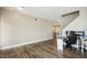 A versatile open space with hardwood floors perfect for a home office or living area at 1033 Leatherstone Ln, Fuquay Varina, NC 27526