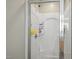 All-white shower stall features built-in shelving for optimal storage at 1033 Leatherstone Ln, Fuquay Varina, NC 27526