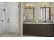 Modern bathroom featuring a glass-enclosed shower and double sink vanity at 1035 Zelkova Lane Ln, Chapel Hill, NC 27517