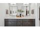 Stylish bathroom featuring double vanity, quartz countertops, modern mirrors, and fixtures at 1035 Zelkova Ln, Chapel Hill, NC 27517