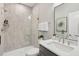 Modern bathroom featuring a glass-enclosed shower, a sleek vanity with a large mirror, and stylish fixtures at 1035 Zelkova Ln, Chapel Hill, NC 27517