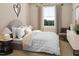 Bright bedroom with a comfortable bed, stylish decor, and ample natural light at 1035 Zelkova Lane Ln, Chapel Hill, NC 27517
