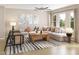 Bright living room with a large sectional sofa, contemporary decor, and a striped rug at 1035 Zelkova Lane Ln, Chapel Hill, NC 27517