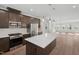 Modern kitchen featuring stainless steel appliances, granite countertops, and stylish pendant lighting at 1035 Zelkova Ln, Chapel Hill, NC 27517