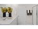 Bathroom with double sink vanity, framed mirror, door, and glass shower with white countertop at 106 Craig Point Dr, Clayton, NC 27520
