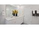 Bathroom with double sink vanity, framed mirror, door, and glass shower with white countertop at 106 Craig Point Dr, Clayton, NC 27520