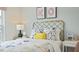 Bright bedroom featuring a patterned bedspread, a decorative headboard, and a window with natural light at 106 Craig Point Dr, Clayton, NC 27520