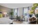 Bright bedroom with two armchairs in front of windows, lamp on bedside table, and decorative plants at 106 Craig Point Dr, Clayton, NC 27520