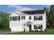 New two-story home with white siding, black shutters, well-manicured lawn, and attached garage at 106 Craig Point Dr, Clayton, NC 27520