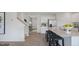 Bright kitchen with stainless steel appliances, a granite island, and a modern design at 106 Craig Point Dr, Clayton, NC 27520