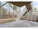 The home has a backyard area with stairs leading up to the deck above at 116 Pointe Park Cir, Holly Springs, NC 27540