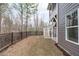 A grass backyard area with a black fence at 116 Pointe Park Cir, Holly Springs, NC 27540