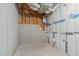 Unfinished basement space with concrete walls, exposed utilities, and wrapped piping at 116 Pointe Park Cir, Holly Springs, NC 27540