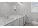 Bathroom featuring dual sinks, granite countertops, and tile flooring at 116 Pointe Park Cir, Holly Springs, NC 27540