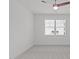 A bright bedroom featuring neutral carpet and ample natural light through the large window at 116 Pointe Park Cir, Holly Springs, NC 27540