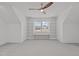 Bedroom featuring custom built-in shelves, window with natural light, and a neutral color carpet at 116 Pointe Park Cir, Holly Springs, NC 27540
