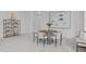 Bright dining area features a round table with seating for six, complemented by stylish decor at 116 Pointe Park Cir, Holly Springs, NC 27540