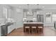 Modern kitchen with an island, stainless steel appliances, and hardwood floors at 116 Pointe Park Cir, Holly Springs, NC 27540