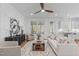 Cozy living room with hardwood floors, comfortable seating, and lots of natural light at 116 Pointe Park Cir, Holly Springs, NC 27540