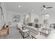 Comfortable living room features neutral paint, plush seating, and a ceiling fan for added comfort at 116 Pointe Park Cir, Holly Springs, NC 27540