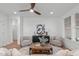 Stylish living room with decorative accent wall and comfortable seating at 116 Pointe Park Cir, Holly Springs, NC 27540