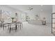 Open-concept living area with comfortable seating, dining space, geometric walls, and abundant natural light at 116 Pointe Park Cir, Holly Springs, NC 27540