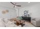 Bright living room with modern furniture, wainscoting, and hardwood floors at 116 Pointe Park Cir, Holly Springs, NC 27540