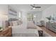 Serene main bedroom features large windows, plush bedding, and stylish decor at 116 Pointe Park Cir, Holly Springs, NC 27540