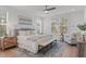 Relaxing main bedroom with large windows, comfortable bedding, and plenty of natural light at 116 Pointe Park Cir, Holly Springs, NC 27540