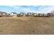 A large grassy area in front of a neighborhood at 116 Pointe Park Cir, Holly Springs, NC 27540