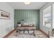 Stylish home office with wainscoting, a rustic desk, a decorative rug, and a bright window at 116 Pointe Park Cir, Holly Springs, NC 27540