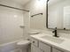Bathroom featuring white subway tile, shower, and vanity with black fixtures at 1210 Westview Ln # 201, Raleigh, NC 27605
