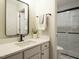 Bright bathroom featuring a modern vanity with sleek fixtures and subway tile shower at 1210 Westview Ln # 201, Raleigh, NC 27605