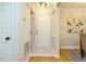 Entry foyer with light walls, white door, and hardwood floors at 1210 Westview Ln # 201, Raleigh, NC 27605