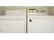 Functional laundry room with washer and dryer at 1210 Westview Ln # 201, Raleigh, NC 27605