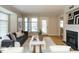 Spacious living room with neutral walls, hard wood floors, fireplace, and natural light at 1210 Westview Ln # 201, Raleigh, NC 27605